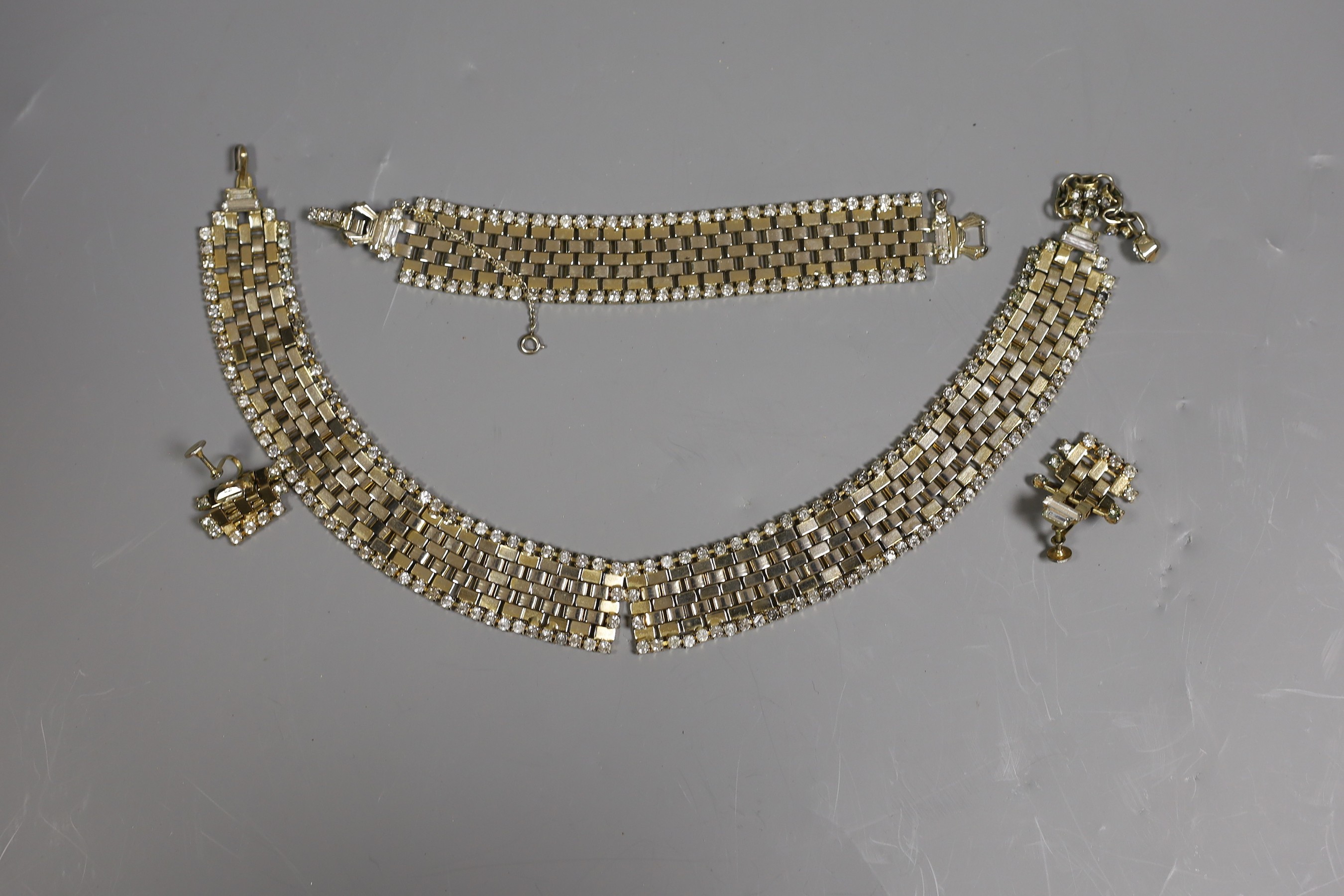 A suite of Denbe costume jewellery, comprising a necklace, bracelet and pair of ear clips.